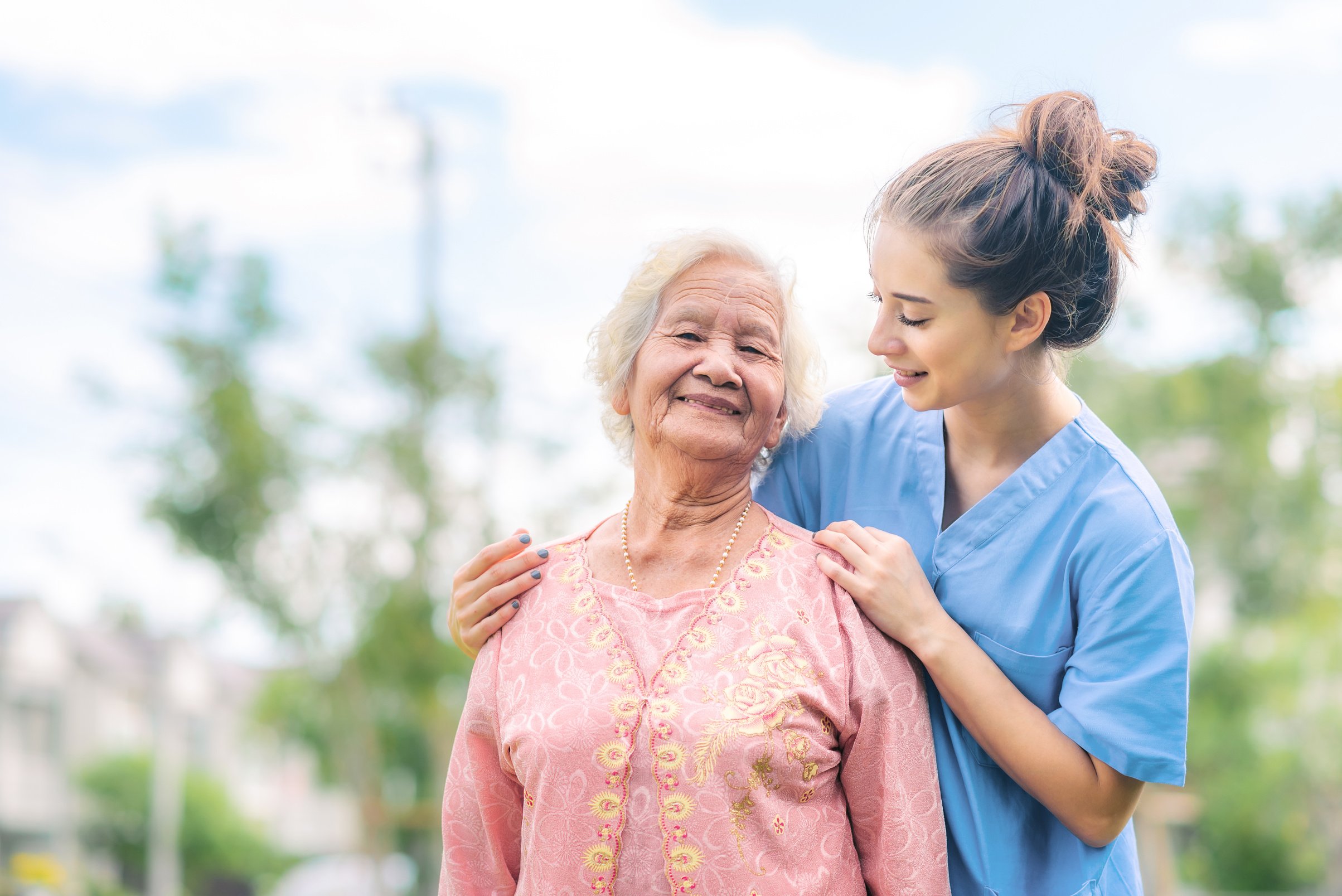 Nurse Caregiver Take Care of Elderly Woman in the Park